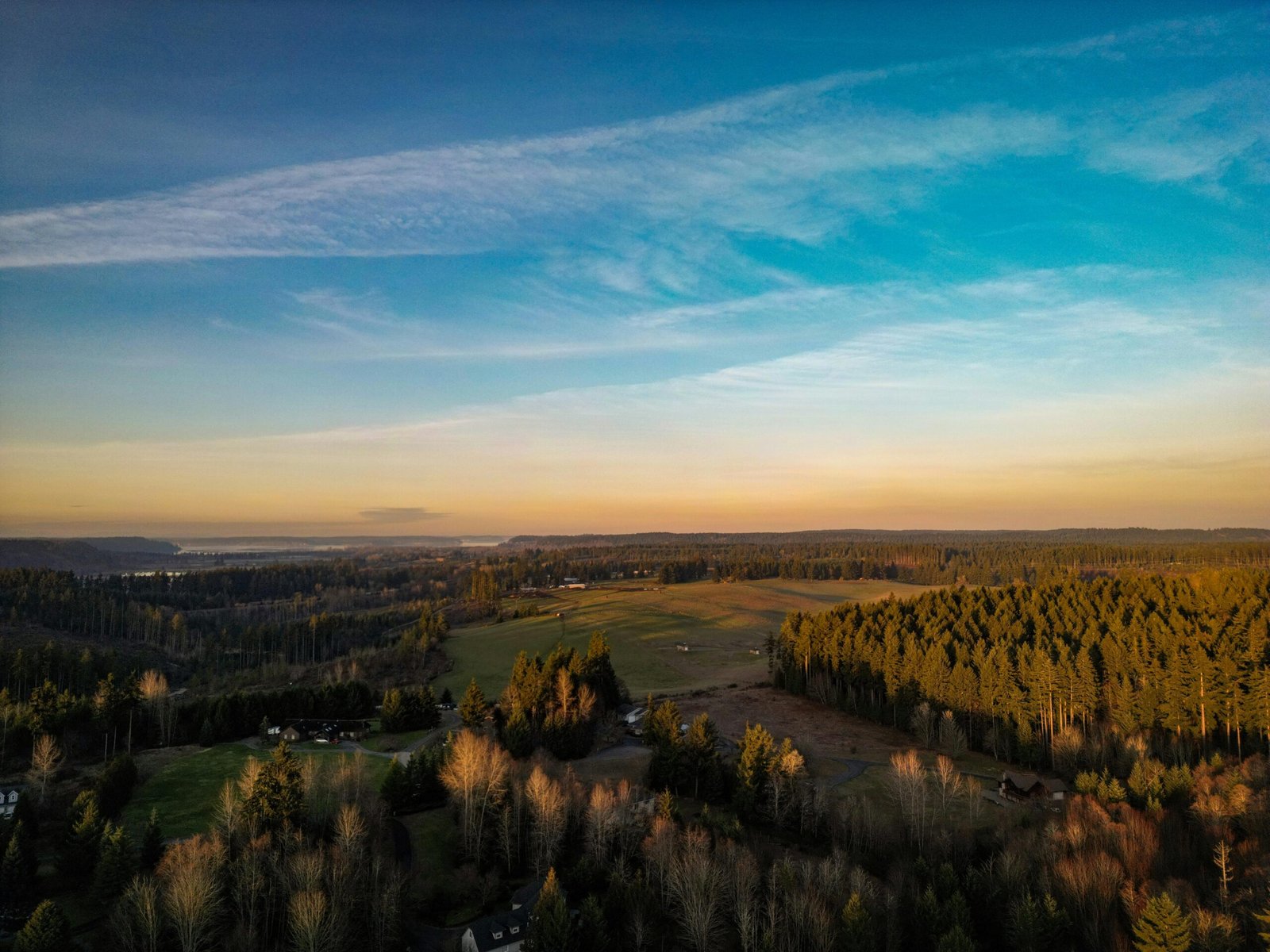Aerial countryside landscape with forest views at sunset