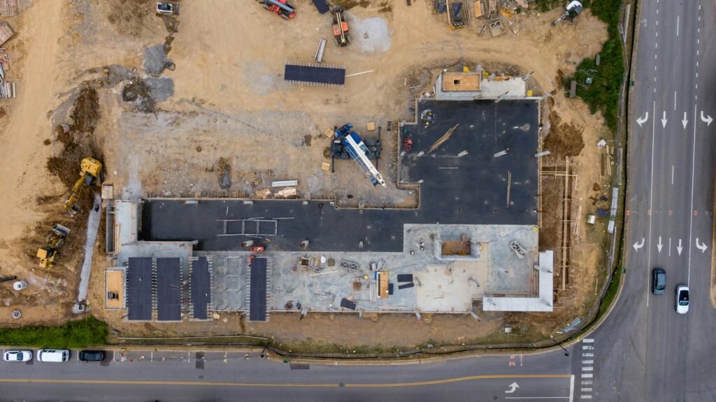 Construction progress monitoring aerial view of an active commercial construction site